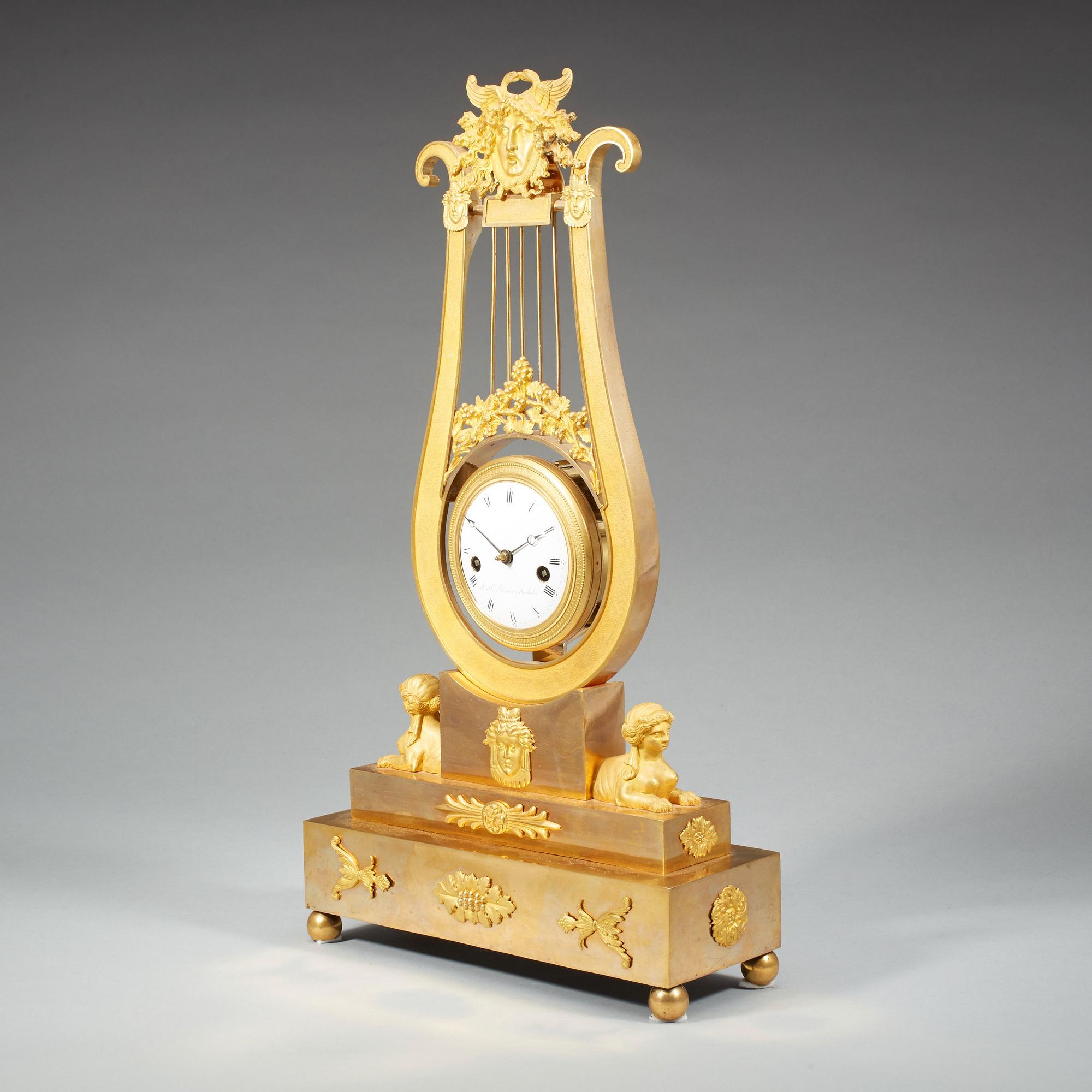 A late Gustavian early 19th century gilt bronze mantel clock.