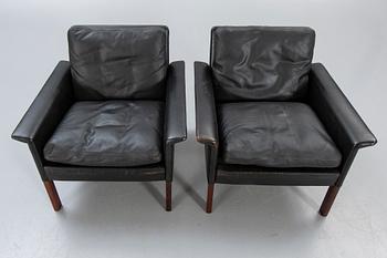 A pair of 1960s leather easy chairs.