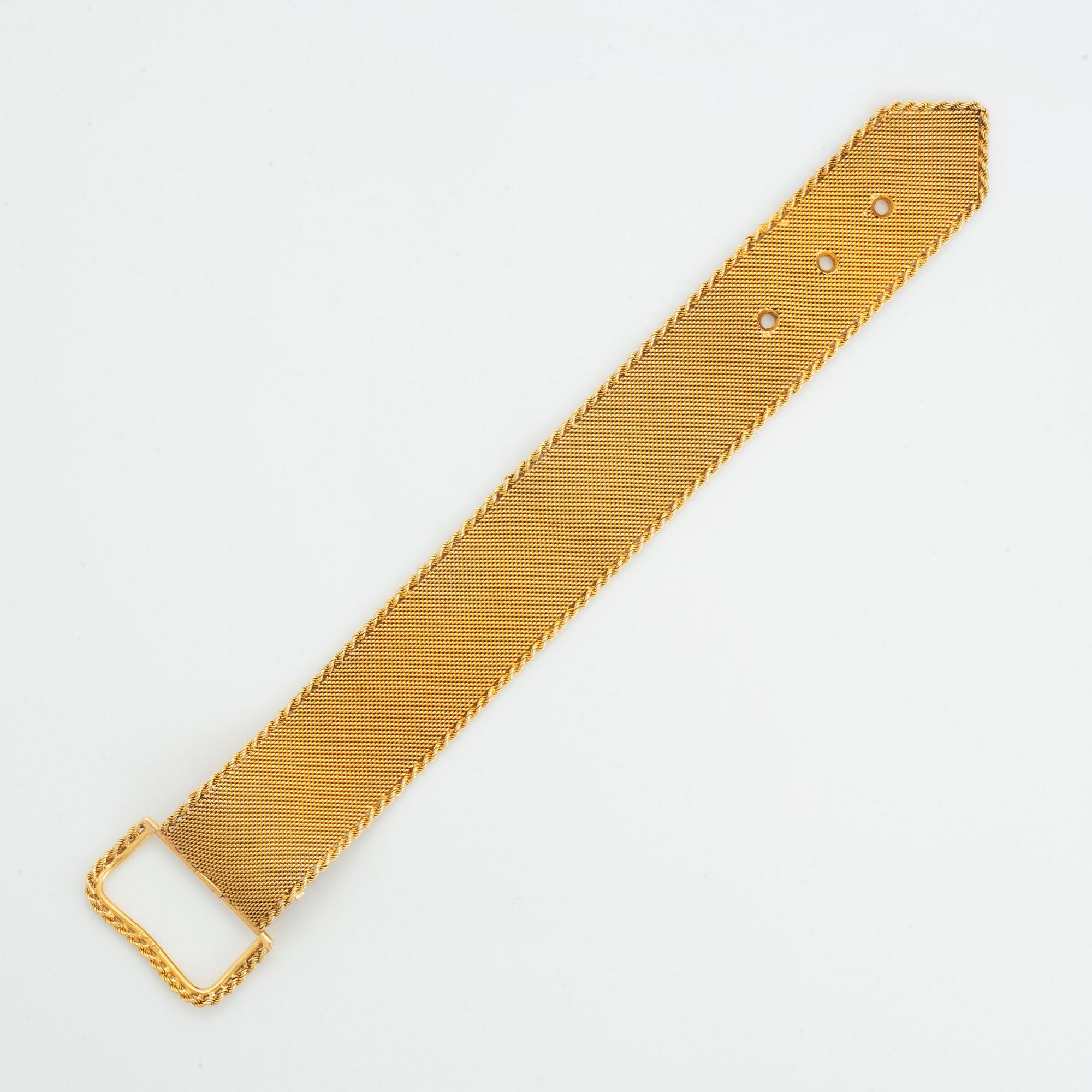 Armband 18K guld i form av ett bälte.