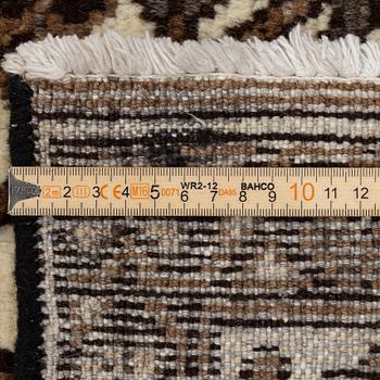 A Ferdos carpet, c. 295 x 210 cm.