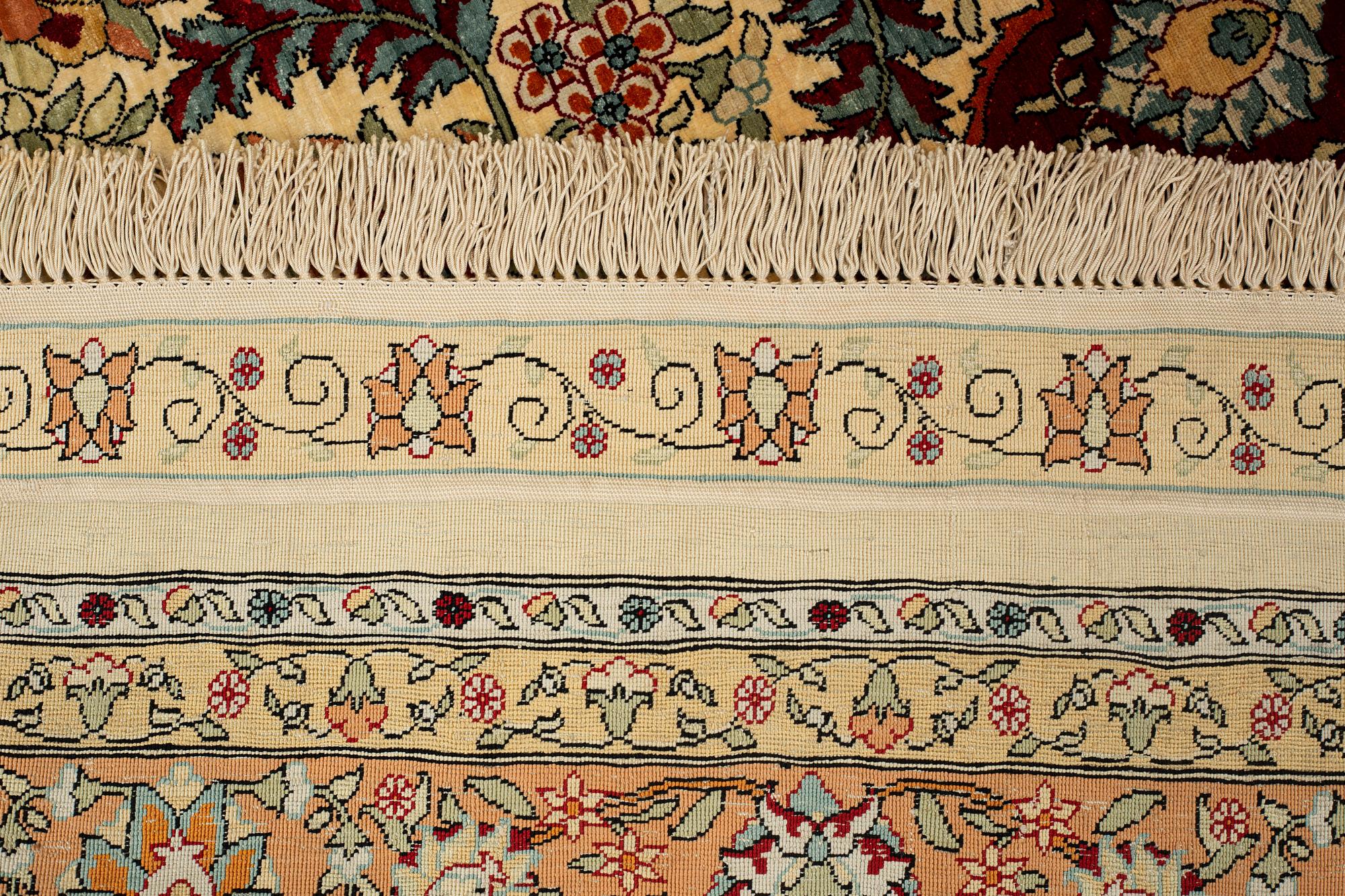 A rug, semi-antique, silke Hereke, signed, ca 184,5 x 118 cm.