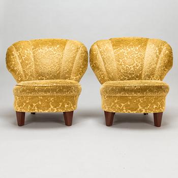 A pair of mid 20th century armchairs.