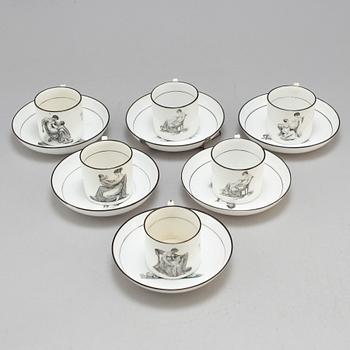 Six soft paste cups with saucers, early 19th century.