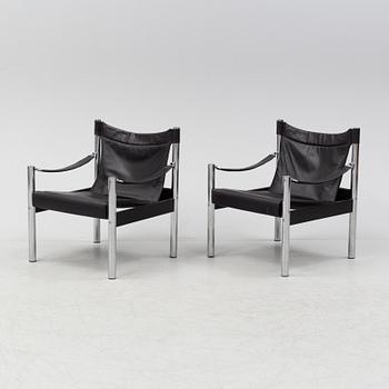 A pair of leather arm chairs, Johansson Design, late 20th Century.