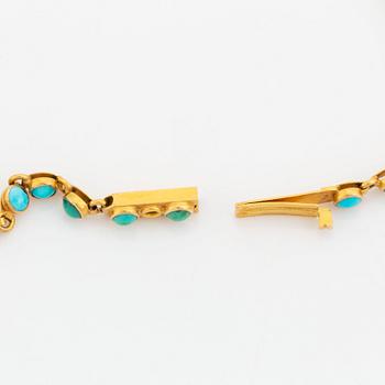 An 18K gold and turquoise cross with a chain and a 14K gold bracelet set with turquoises.