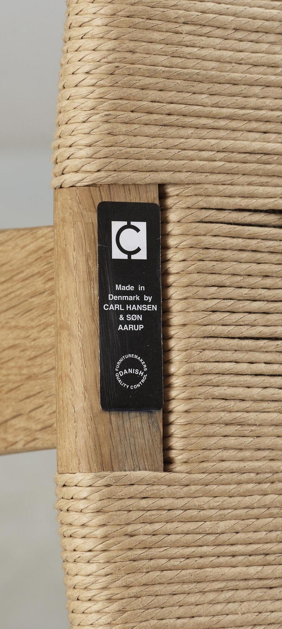 A set of six Hans J Wegner oak 'Wishbone chairs', Carl Hansen & Søn, Denmark.