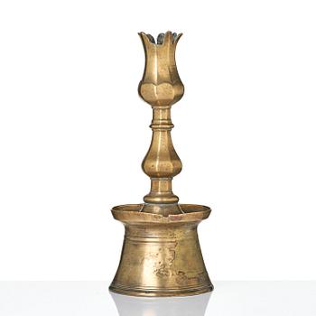 An Ottoman brass 'Tulip' Candelstick, Turkey, 17th/18th century.
