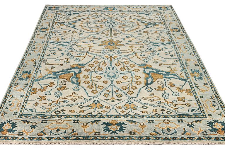 An oriental carpet with Mamluk design, c. 302 x 234 cm.