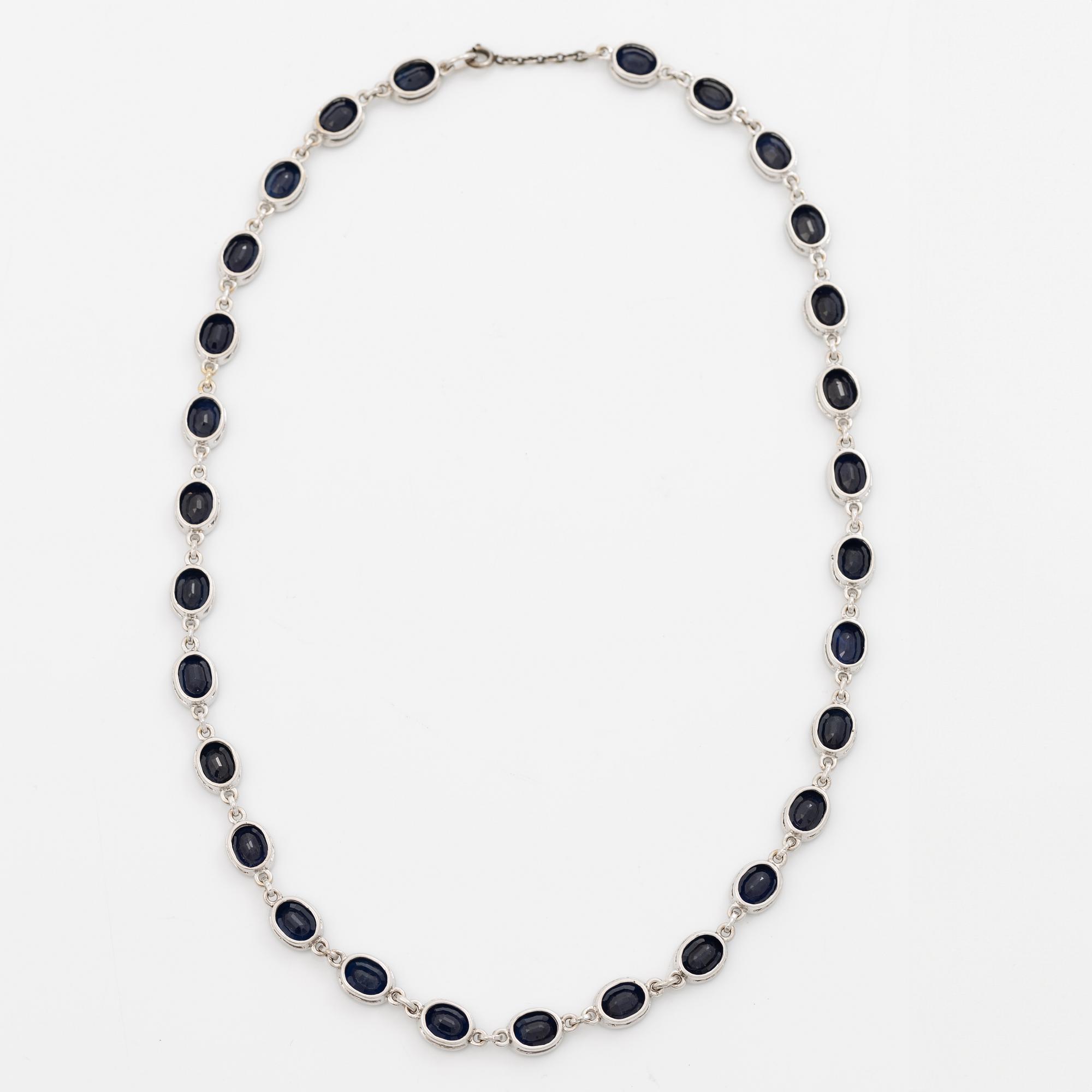18K white gold necklace with dark sapphires.