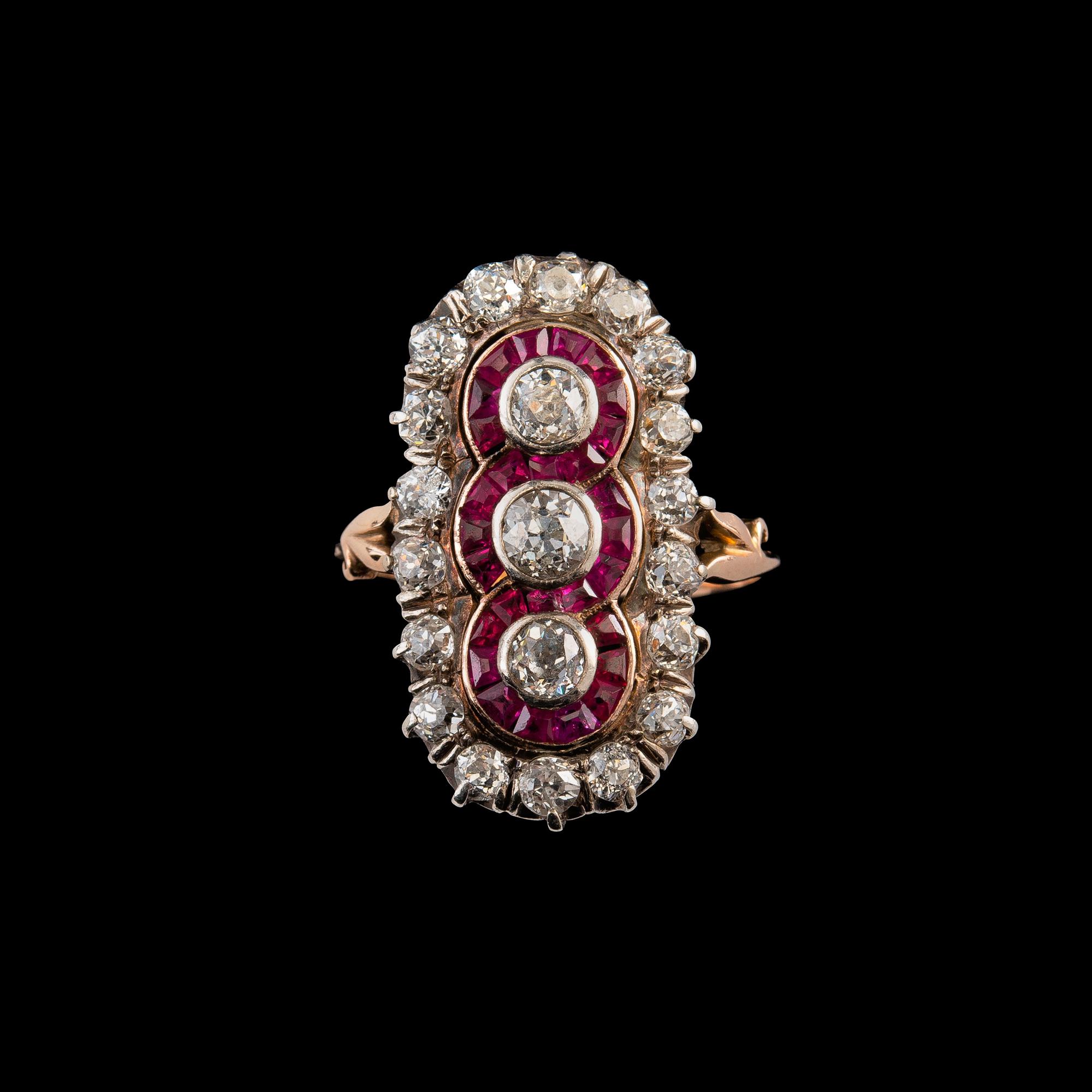 A RING, old cut diamonds c. 2.50 ct. 28 rubies. 14K gold. Likely Russia early 1900 s. Weight 6,3 g.