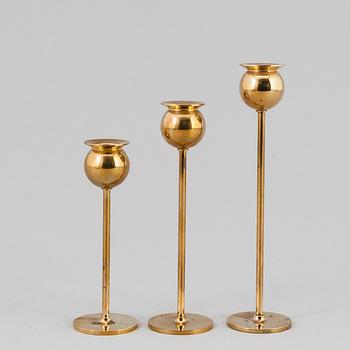 Pierre Forssell, A set of three 'Tulip' brass candlesticks by Skultuna Bruk, 1993.