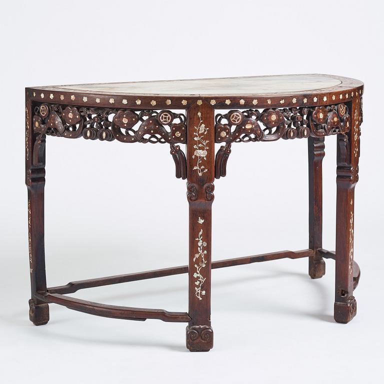 A Chinese hardwood demi-lune side table with mother-of-pearl inlays, late Qing dynasty.