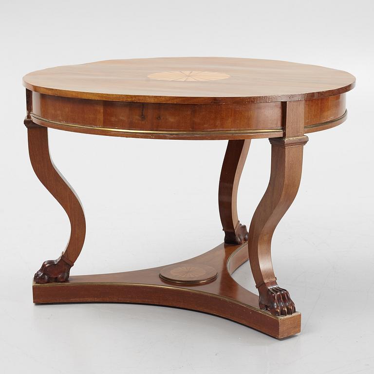 A mahogany veneered Empire style table, first half the 20th Century.