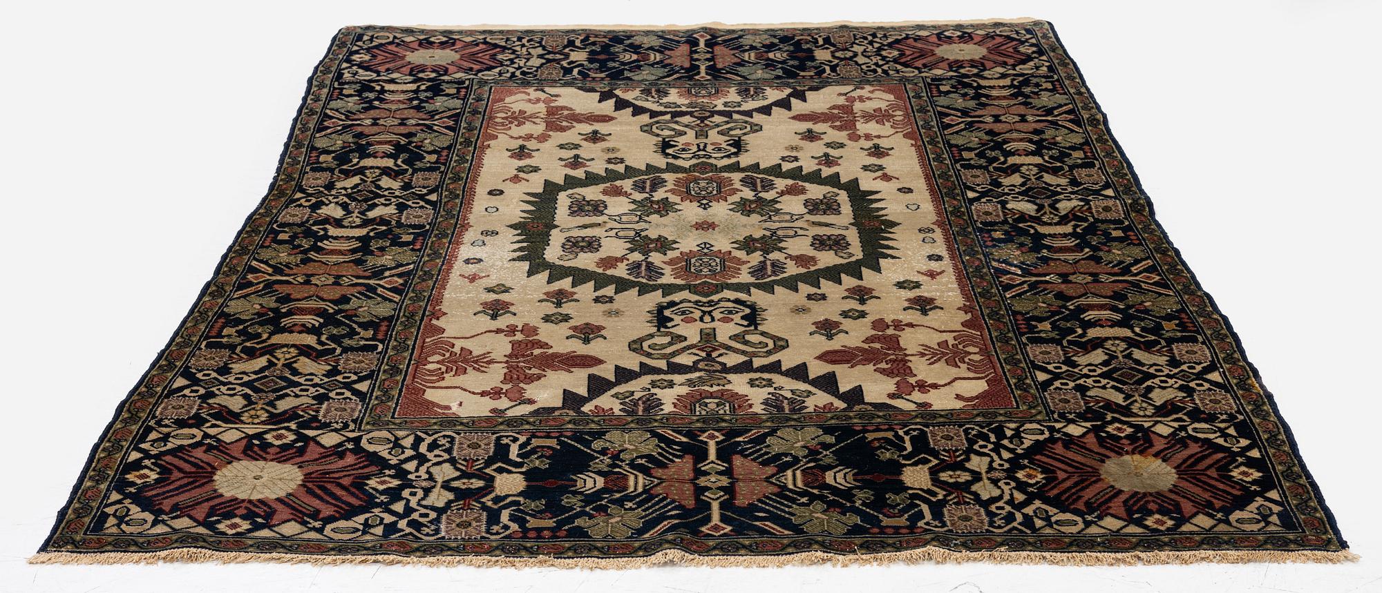 An antique Malajir rug, c. 179,5 x 124 cm (as well as one end with 2.5 cm flat weave).