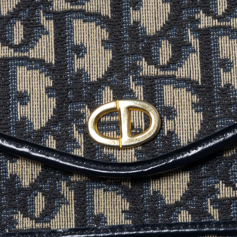 Christian Dior, a clutch and a scarf.