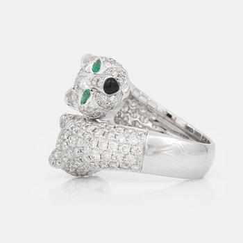 665. A brilliant-cut diamond, 3.36 cts, agate and emeralds, 0.15 ct, ring.