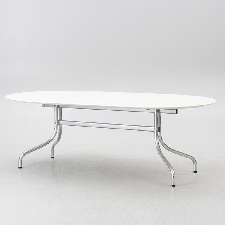 Vico Magistretti, a "Shine" dining table with twelve chairs, De Padova, Italy, around the year 2000.