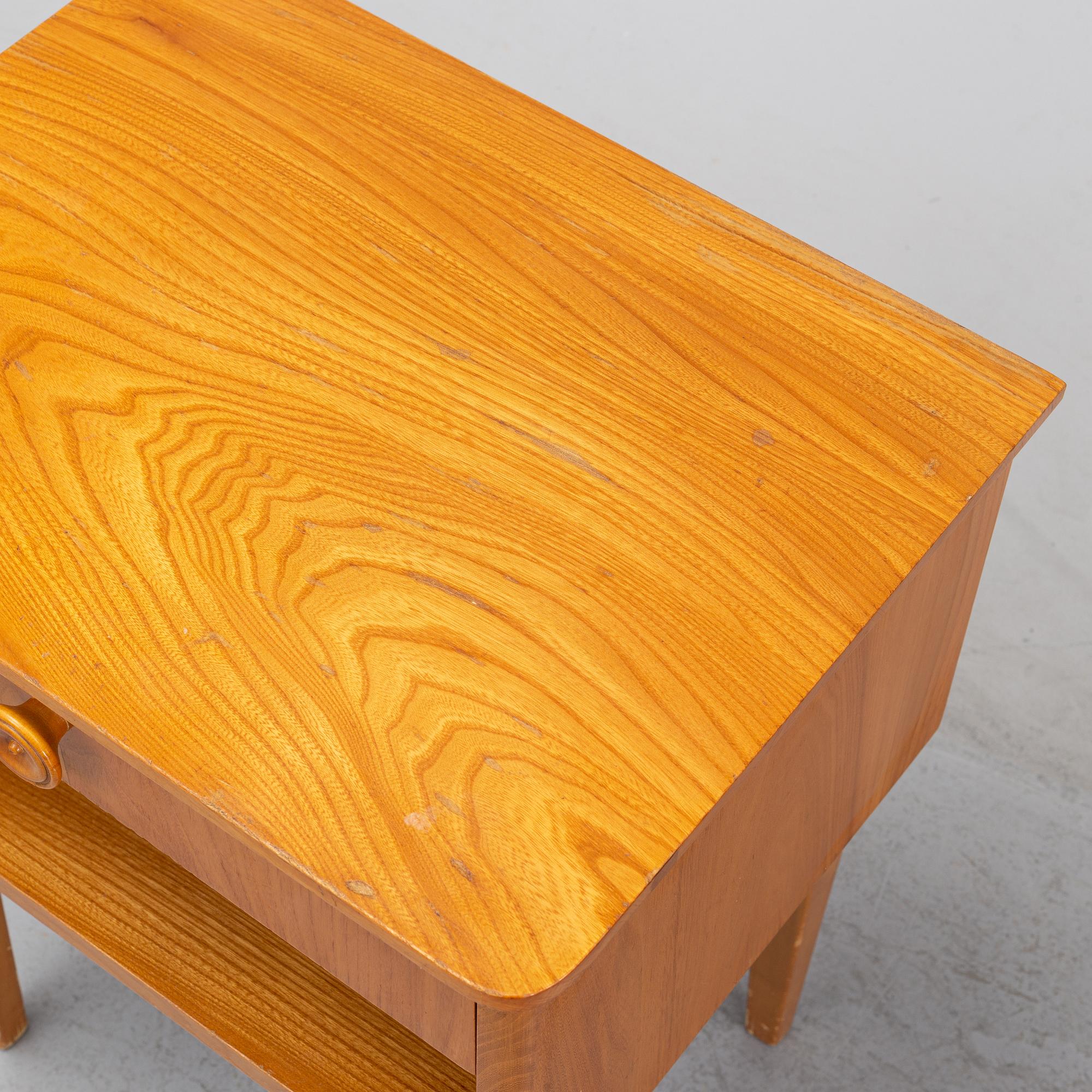 A pair of elm wood bedside tables, mid 20th Century.