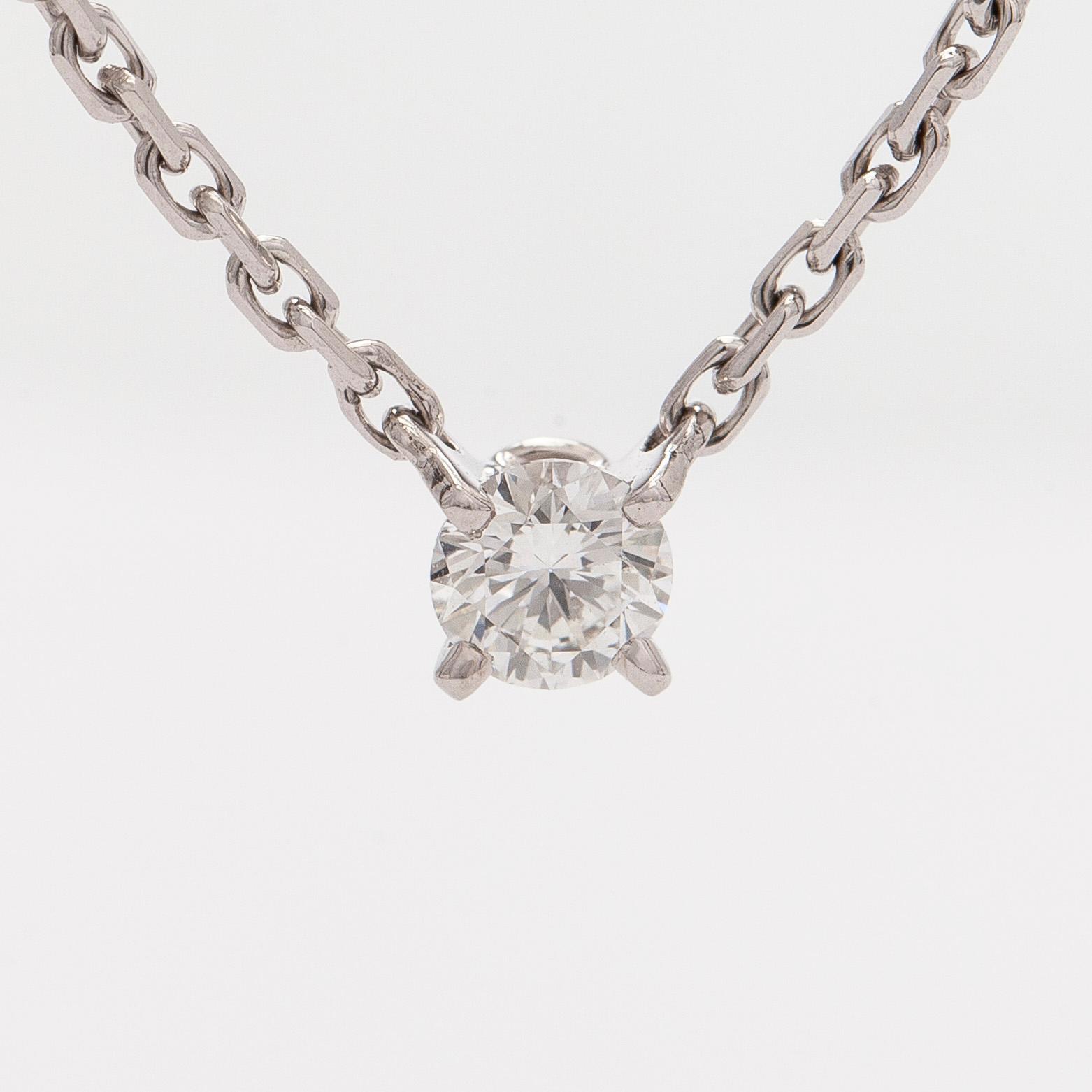 Cartier, an 18K white gold '1895' necklace with a brilliant-cut diamond.