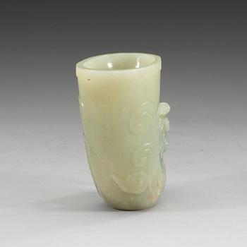 A Chinese carved nephrite rhyton beaker.