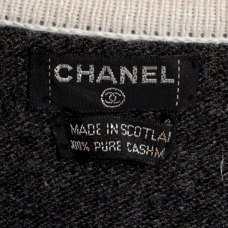 CHANEL, a grey cashmere jacket and skirt.