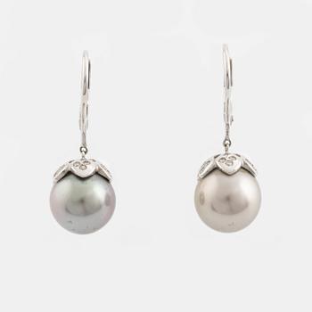 A pair of cultured pearl and brilliant cut diamond earrings.