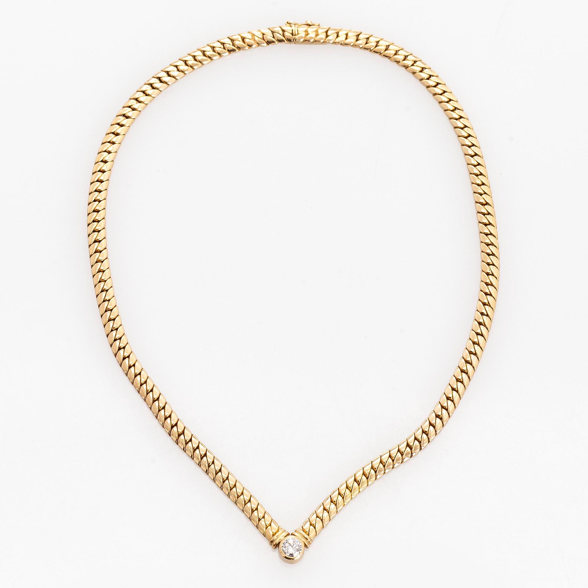 Collier, 18K guld och en briljantslipad diamant.
