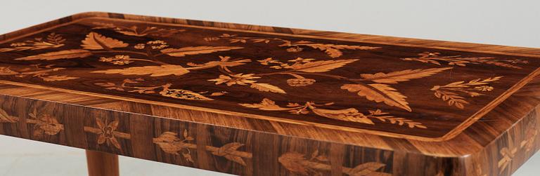 A Carl Malmsten mahogny table with inlays of different exotic woods, Sweden 1935.