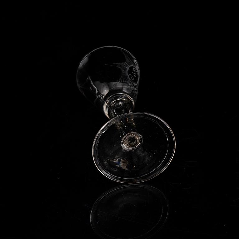 A wine glass with the monogram of the Swedish king Adolf Frederick, 18th Century.