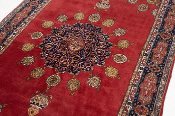 An oriental rug, c. 245 x 150 cm.