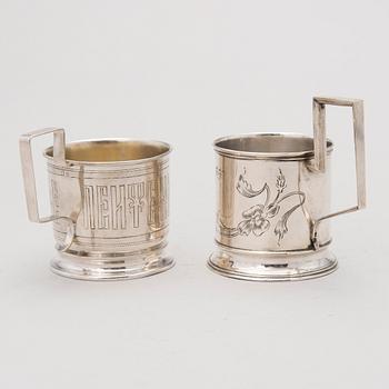 Two tea glass holders in silver, one with mark of Ivan Saltykov, Moscow 1889, the other one marked Moscow 1908-1917.