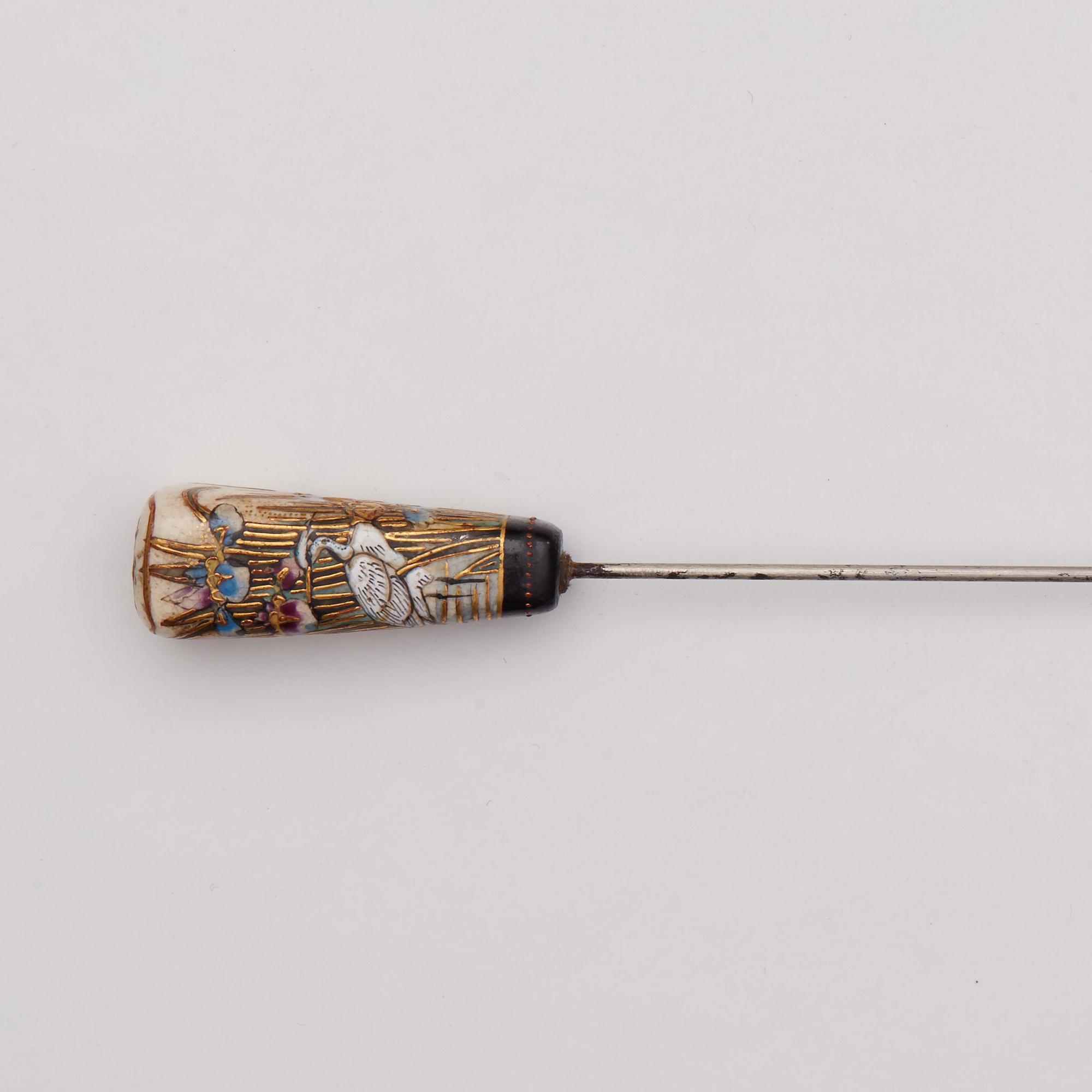A Japanese painted hat pin, Meiji (1868-1912).