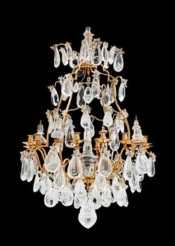 540. A late Baroque-style circa 1900 rock crystal twelve-light chandelier.