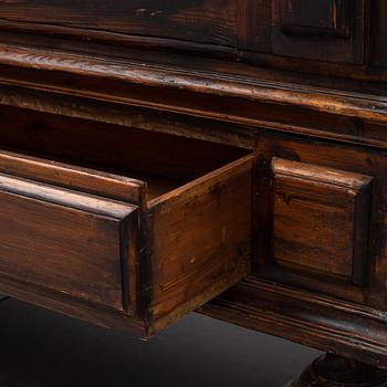 A first half of the 18th Century Baroque stained pine cabinet.