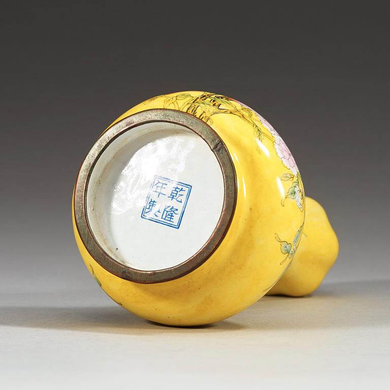 A yellow enamel on copper vase, Qing dynasty (1644-1912), with Qianlong four character mark.
