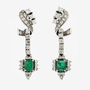 Earrings, 14K white gold with emeralds and brilliant- and octagon-cut diamonds.