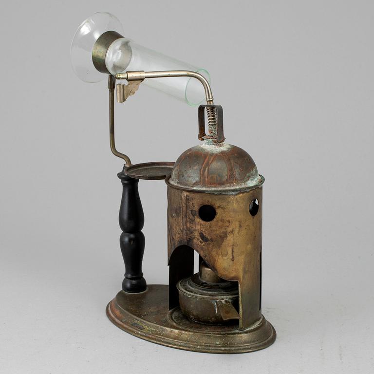 A tinplate burner, 20th century.