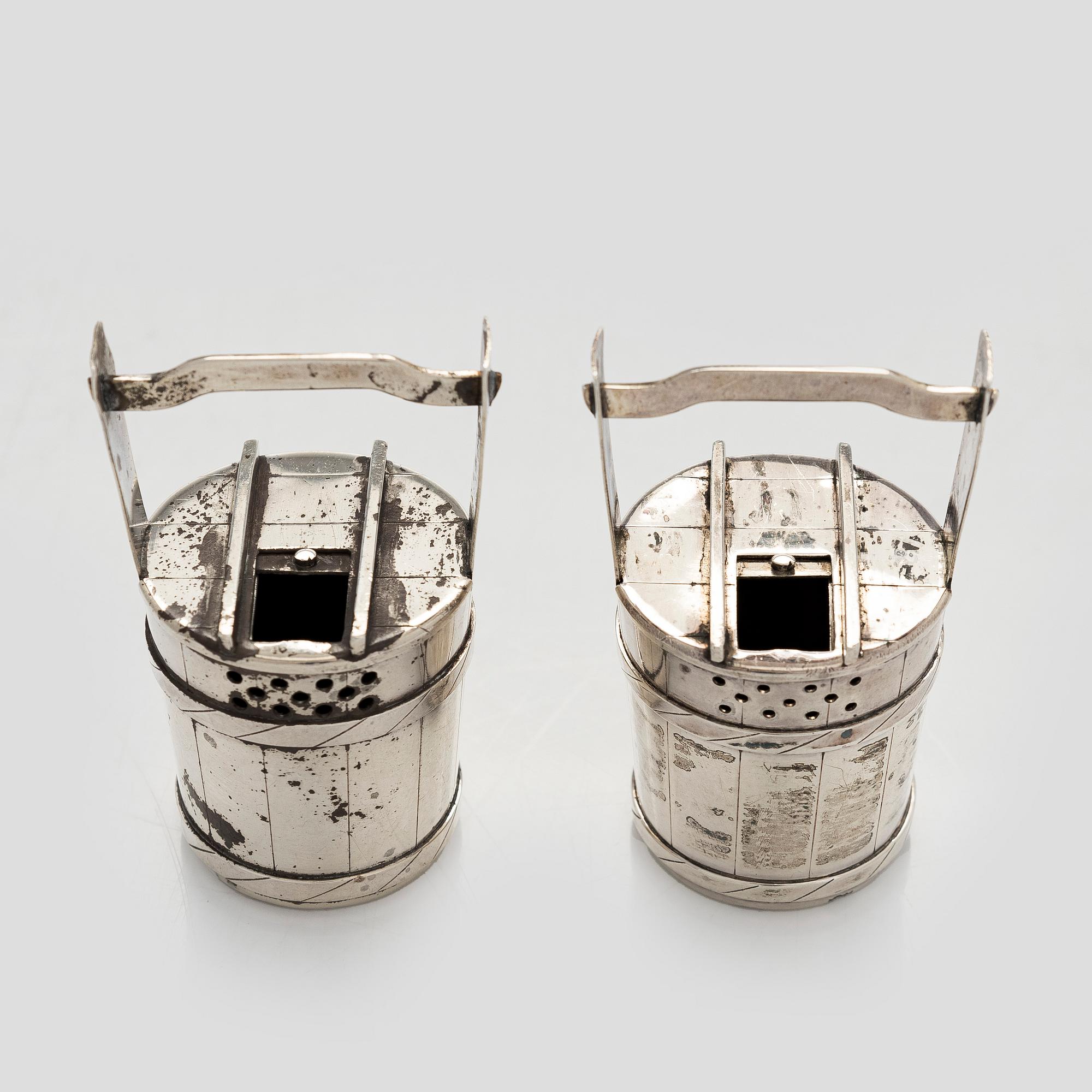 A pair of sterling silver salt- and pepper shakers , Japan, latter half of the 20th century.