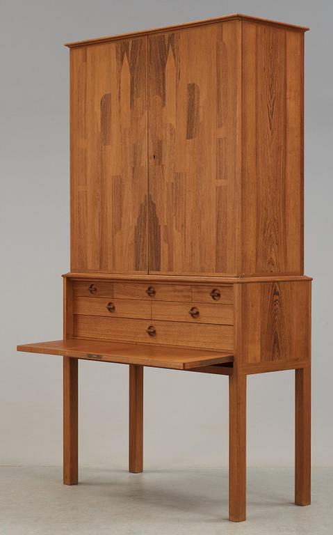 A Carl Malmsten mahogany cabinet with inlays of different types of wood, signed and dated 1958.