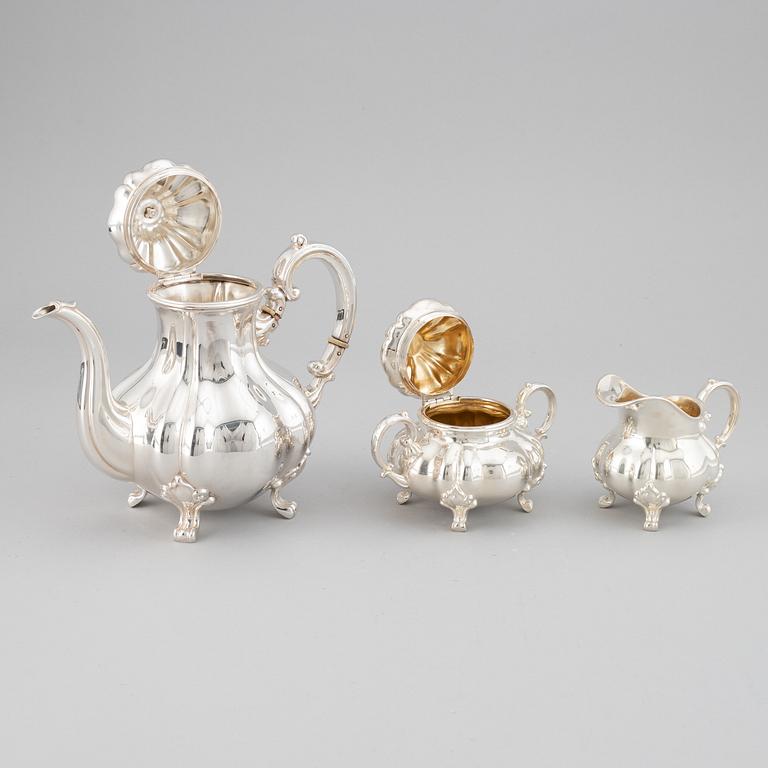A 20th century silver coffee pot, creamer and sugar bowl. Swedish import mark.