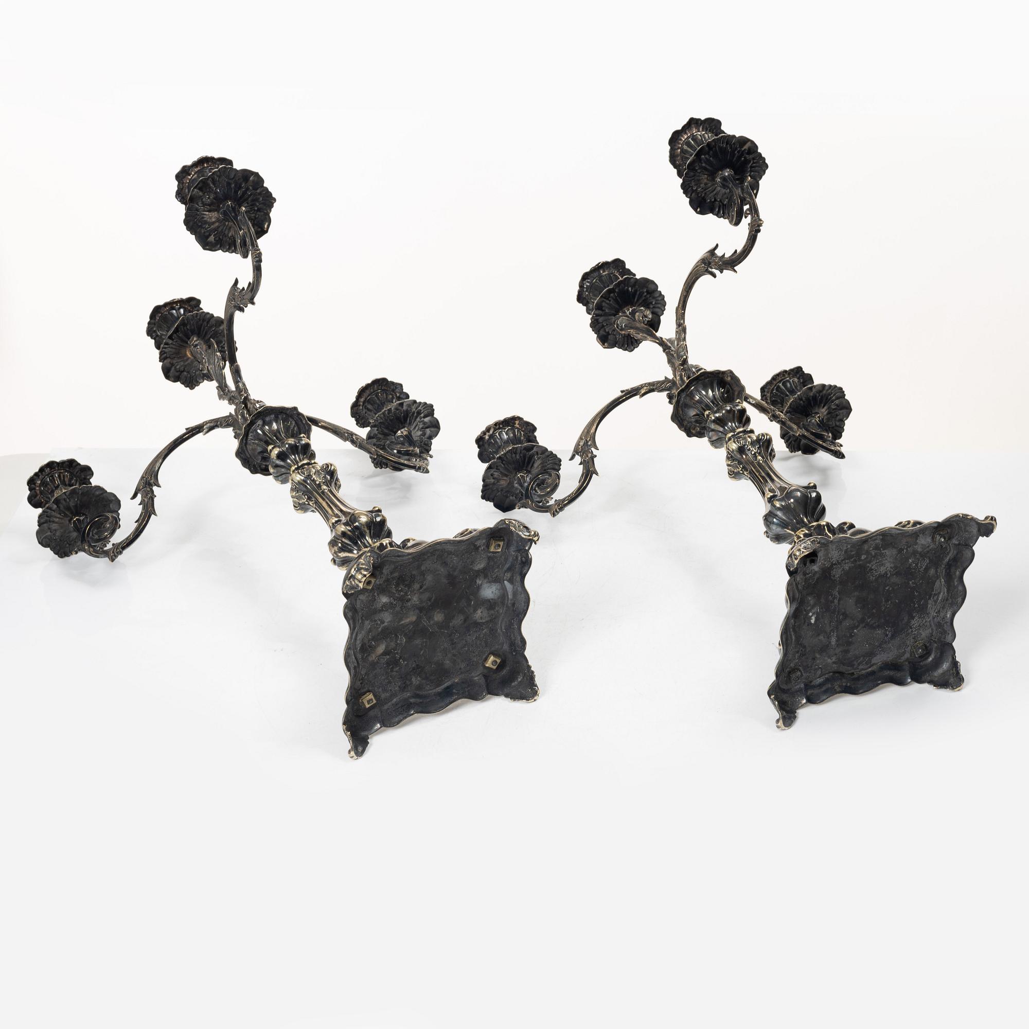 A pair of silver plated Rococo style candelabra, 20th century.