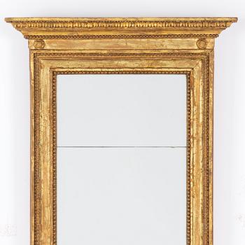 An Empire mirror, first half of the 19th Century.