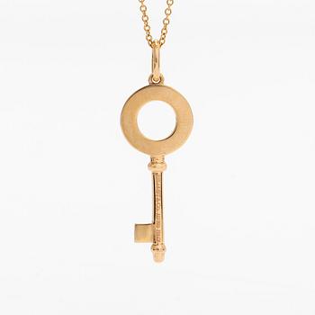 Tiffany & Co, an 18K gold 'Atlas Key' pendant with chain.