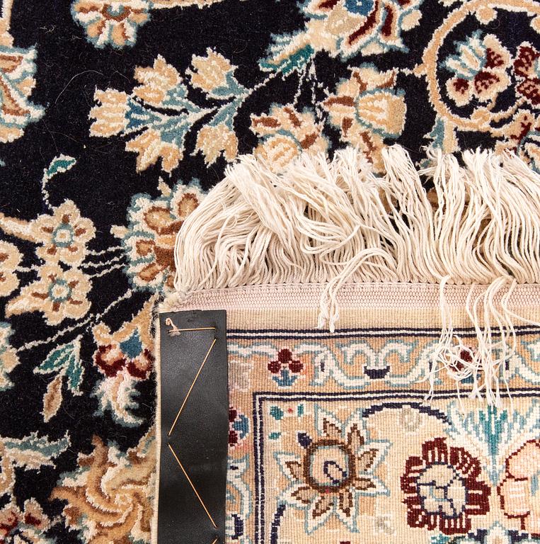 A Nain part silk carpet ca 212x133 cm.