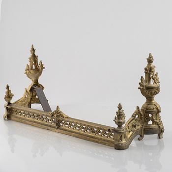 A pair of Louis XVI-style bronze andirons, France, later part of the 19th century.