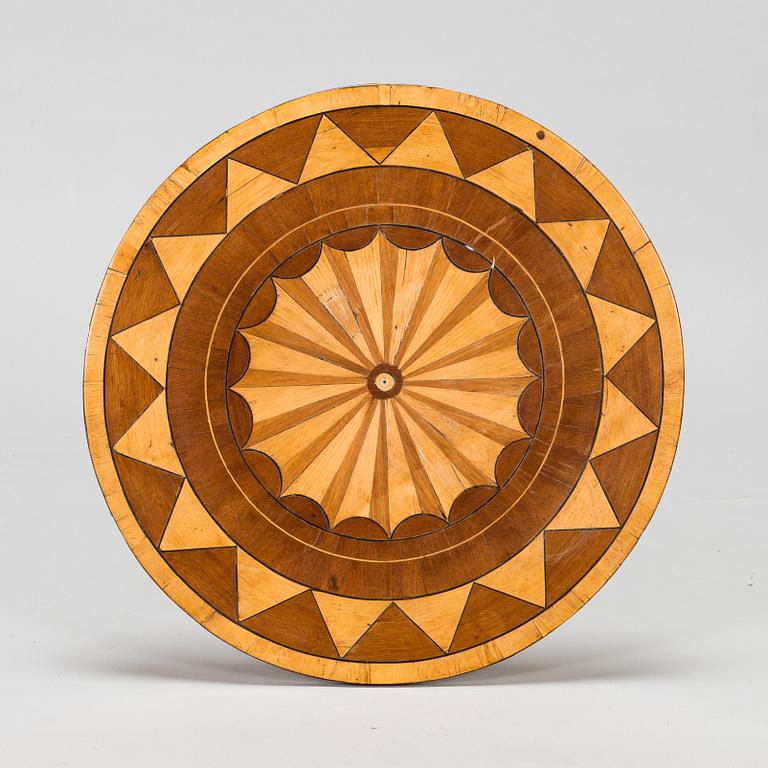 A tilt top table from 19th Century.