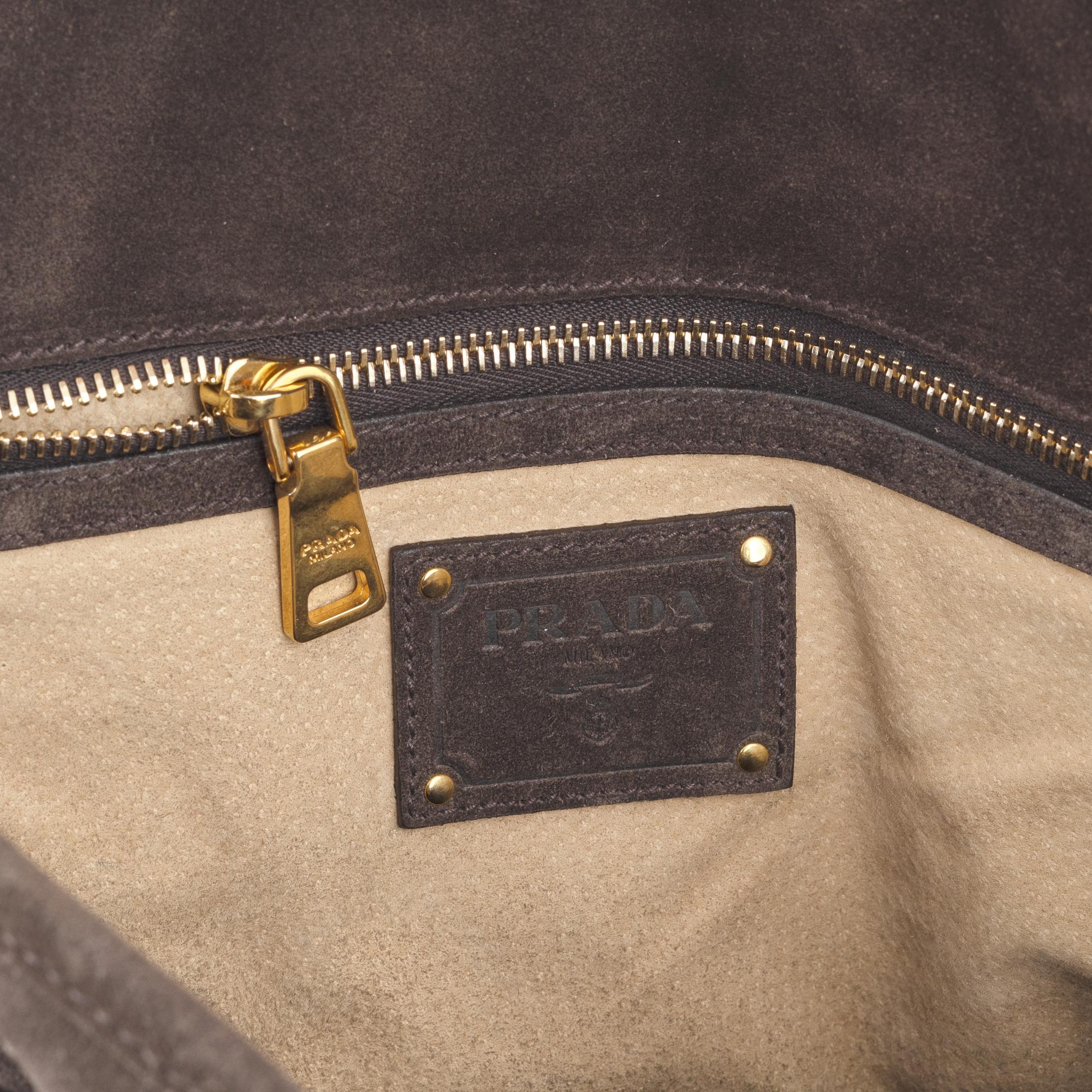 Prada, a chocolate brown suede handbag.
