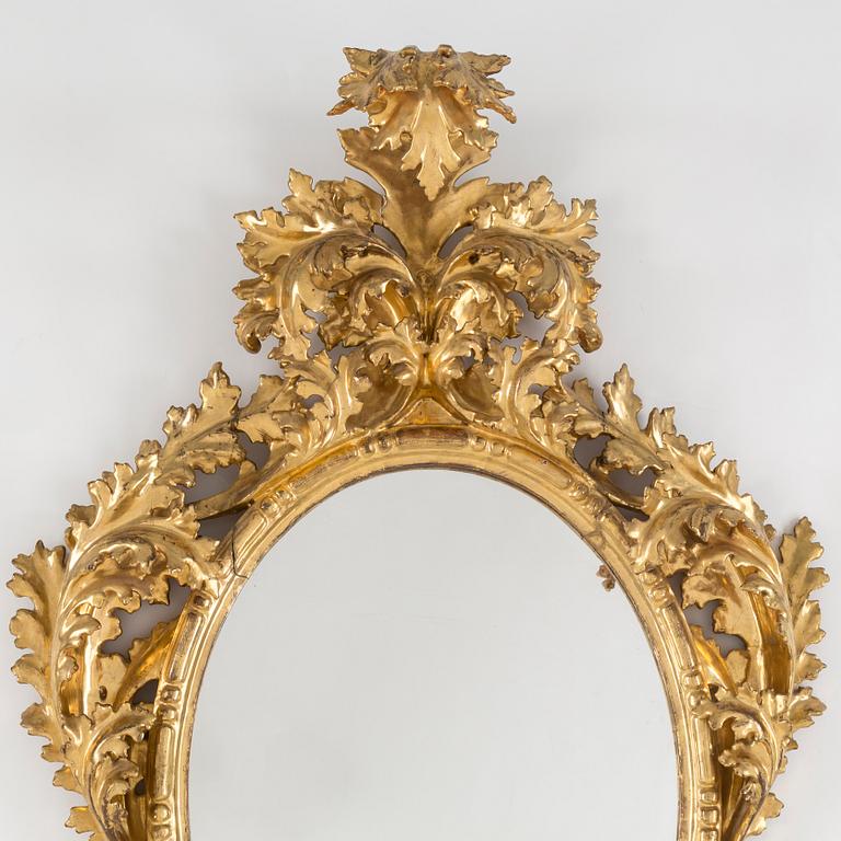 A 20th century Baroque style mirror.