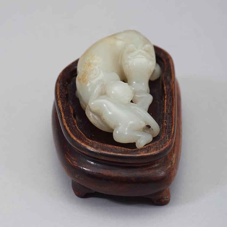 A Chinese nephrite figure of a reclining horse and a monkey, early 20th Century.