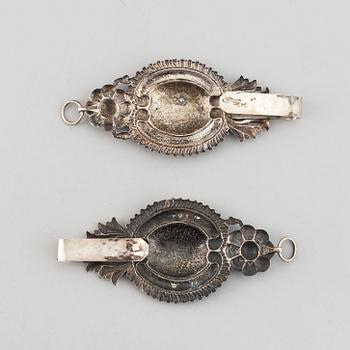 A pair of 19th century silver curtain tie-backs.